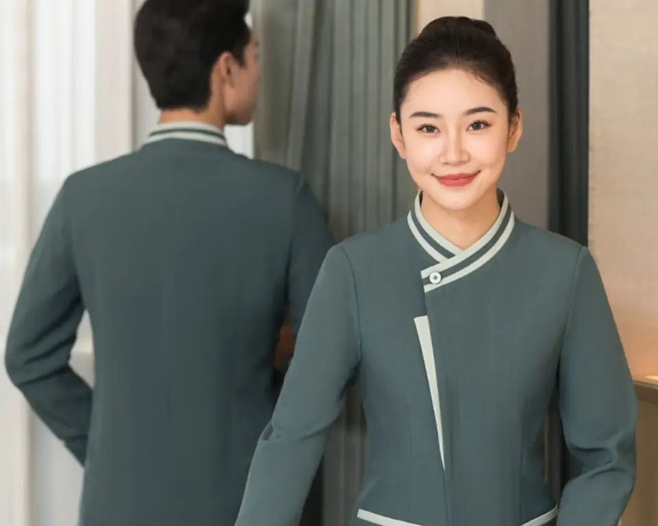 Hotel staff in custom-made uniforms with contrast trim