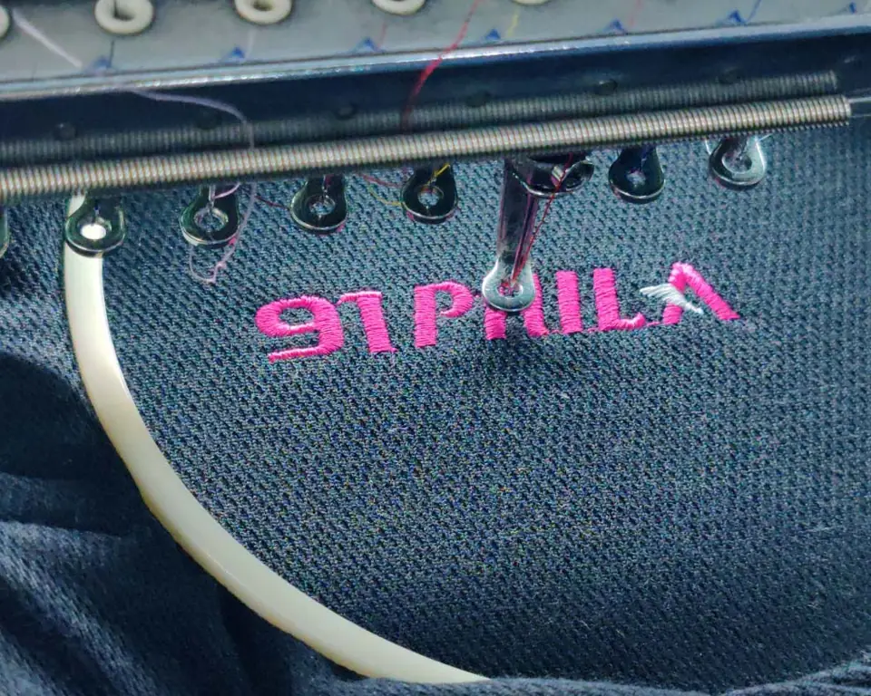 91 PHILA logo embroidered on navy fabric